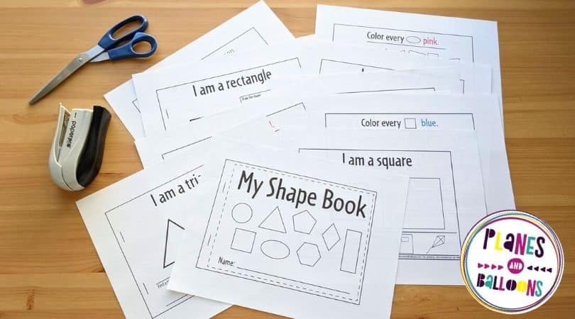 pages of printed shape book on a wooden table 