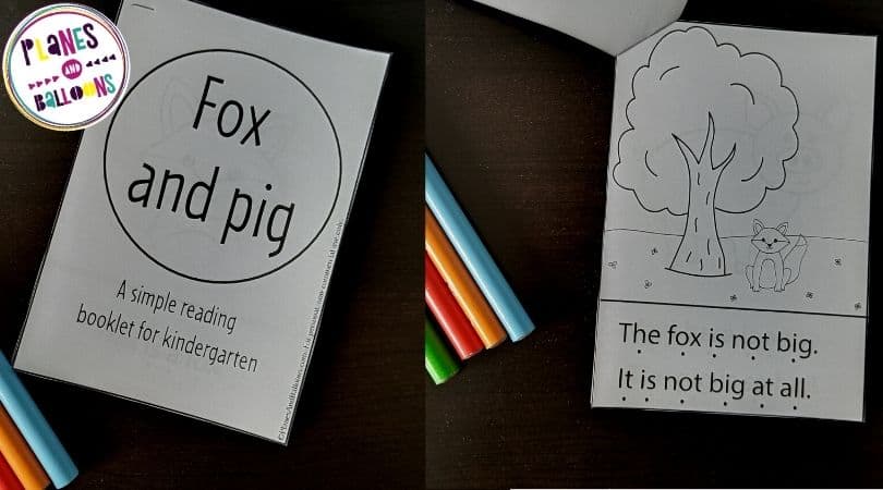 Two reading booklets for kindergarten on black tabletop with pencils