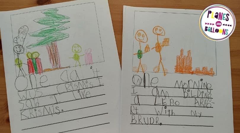 Writing practice in kindergarten with incorrect spelling - two pages on wooden table